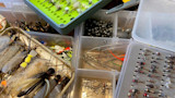 Fly-fishing tackle boxes with assorted flies, jigs, split-shot sinkers and snap swivels