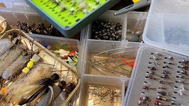 Fly-fishing tackle boxes with assorted flies, jigs, split-shot sinkers and snap swivels