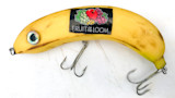 Banana-shaped fishing lure labeled FRUIT OF THE LOOM with two treble hooks