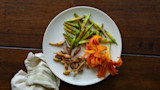 Plate with sauteed daylily buds, fried bulbils, and bright orange daylily petals