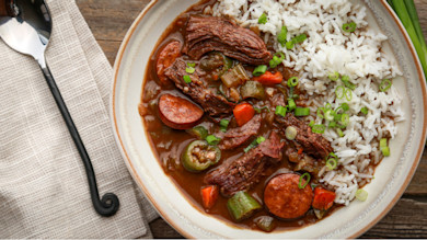 Duck gumbo with rice, andouille sausage, okra, carrots and sliced scallions