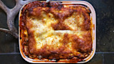 Venison and fennel lasagna, browned cheese in rectangular baking dish with antler beside