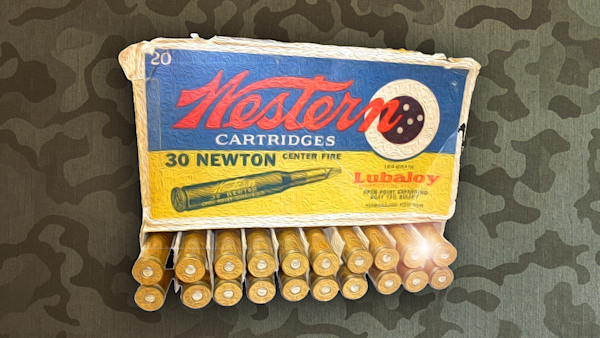 Western Cartridges box reading "30 NEWTON CENTER FIRE" and "Lubaloy", row of brass cartridges