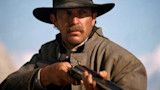 Man in wide-brim hat aiming a double-barrel shotgun