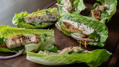 Lettuce wraps with grilled fish, black sesame, cilantro, carrot and red onion ribbons