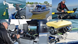 Boat named Bruce's Legacy with deployed underwater ROV, operator at controls and monitor