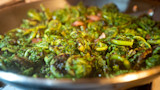 Sauteed fiddlehead ferns in a skillet