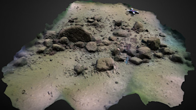 3D scan of rocky ground with scattered boulders and a small model airplane