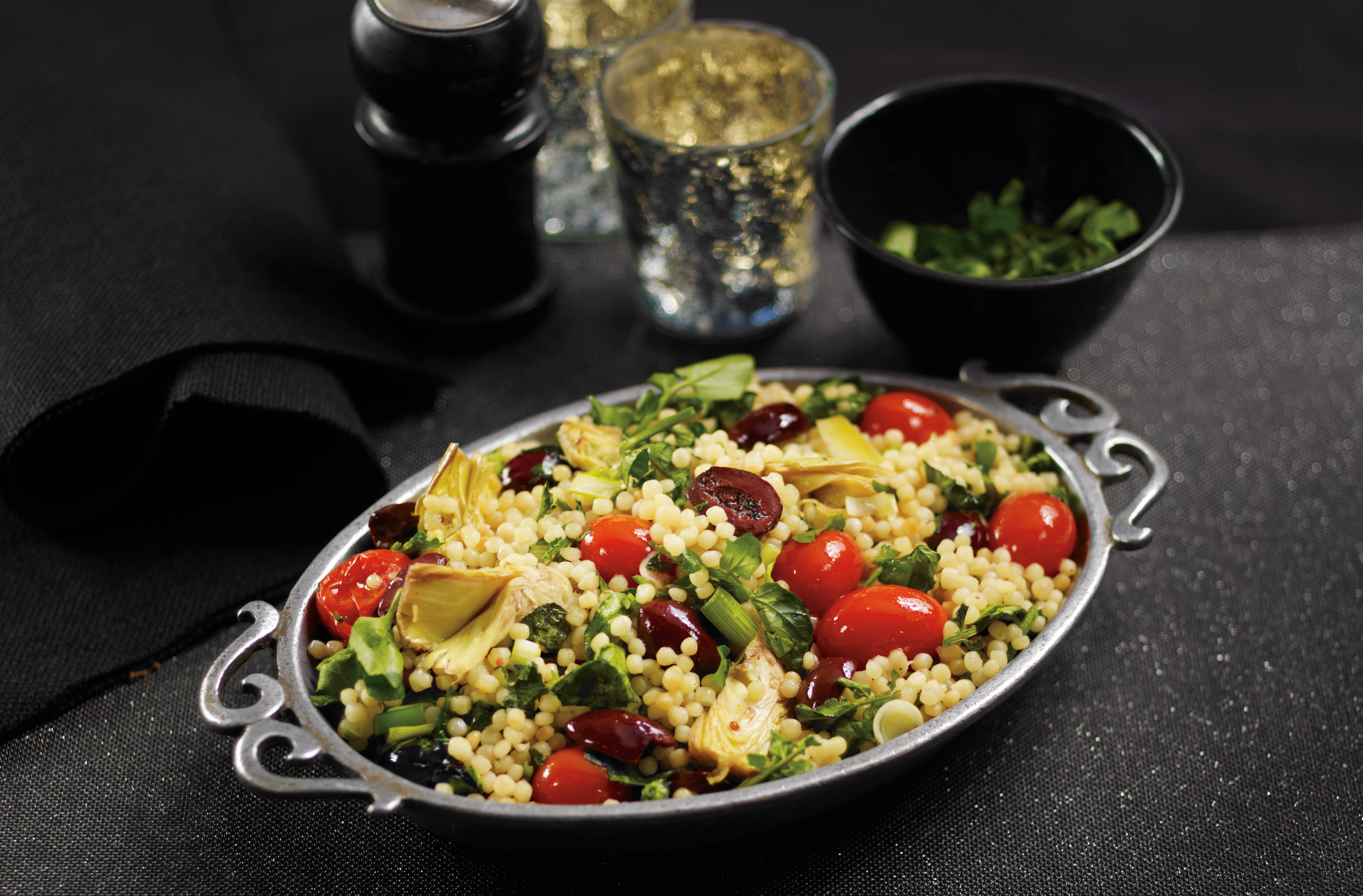 Couscous with  tomatoes, black olives, chopped artichoke hearts, watercress
