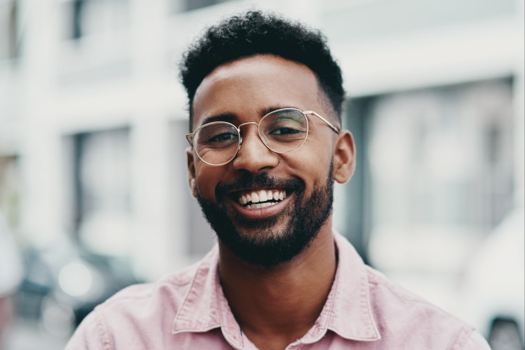 Man wearing eyeglasses frames smiling