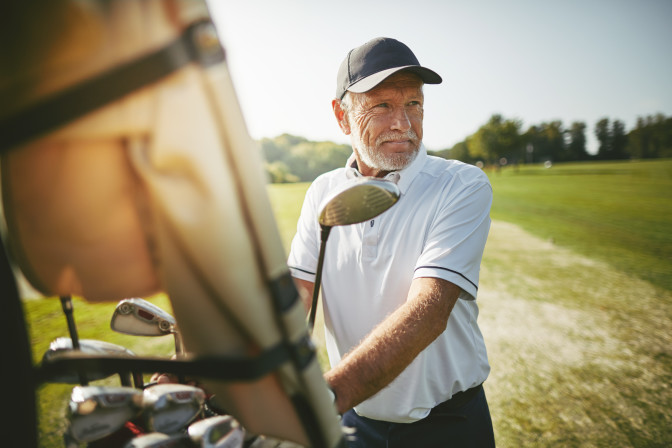 Glaucoma patient older man playing golf