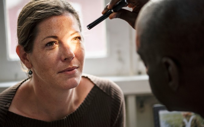 Woman at eye doctor dry eye treatment exam