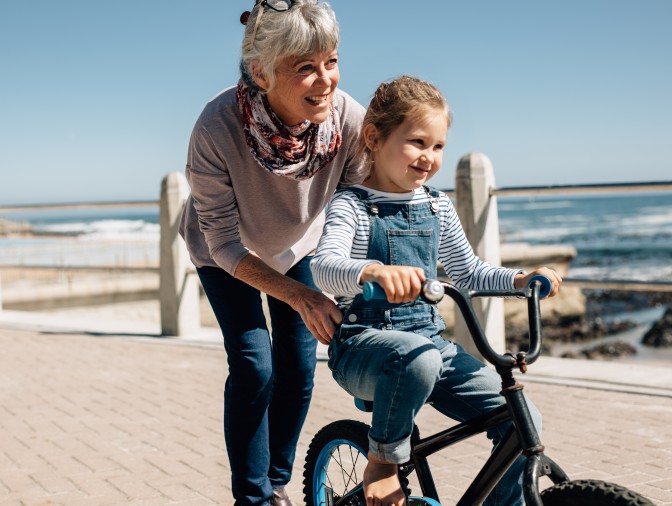 Image of older woman cataract glaucoma patient with child riding a bike