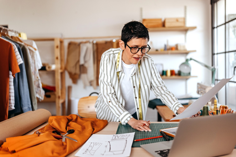 Woman working with fabric wearing prescription eyeglasses