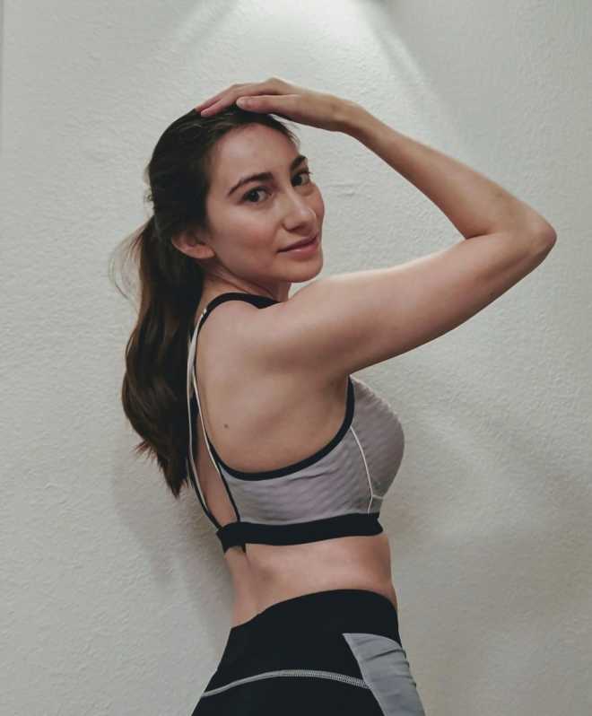 side shot of auther in fitness gear