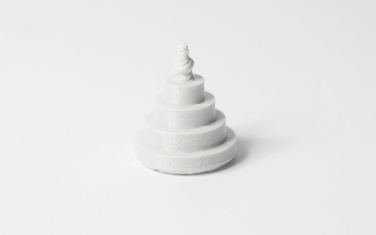 3D printed part that shows vertical pins with decreasing diameter.