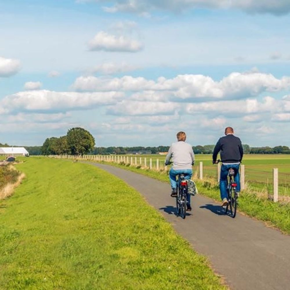 Pension image, two people cycling in the nature