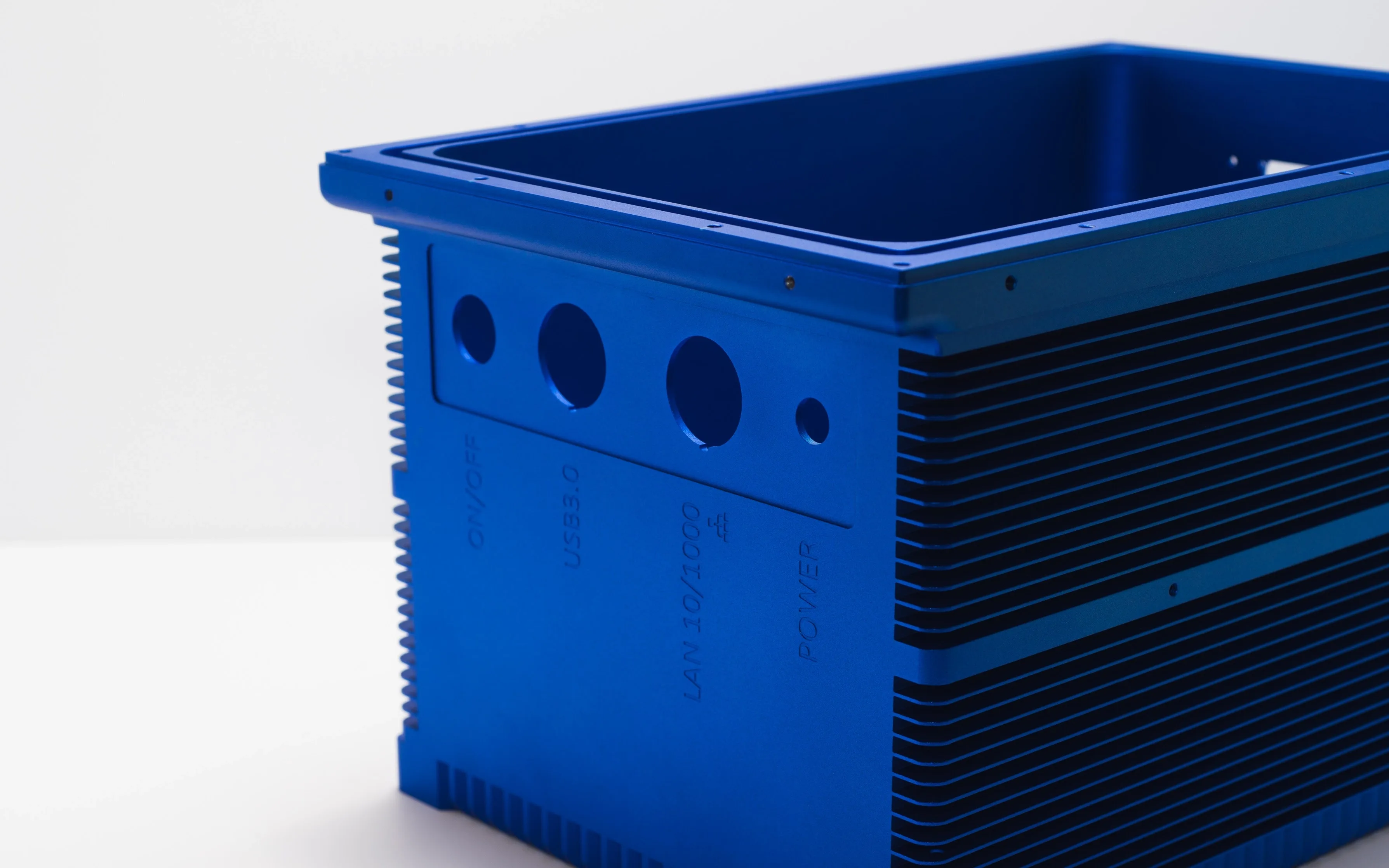 A CNC-milled part that has been anodized and colored blue
