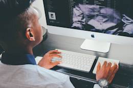 Man in front of computer.