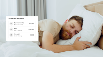 A man with a beard sleeps in bed peacefully.