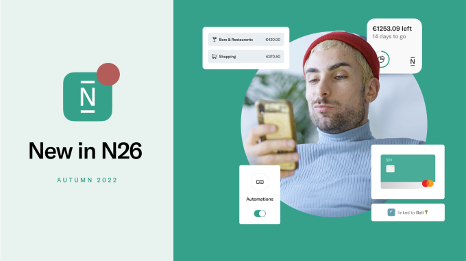 Man checks his phone. New in N26 features.