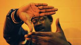 Man framing with his hands.