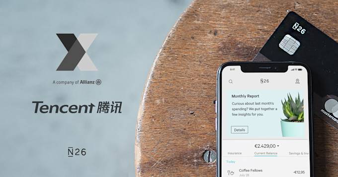 iPhone X and an N26 card on a table.