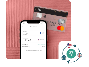N26 cross-border payments feature showing a bank transfer from euros to US dollars and an transparent N26 card.