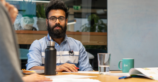 N26 employer sitting at the table at the German Class.