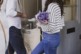 Woman in stripped shirt with flowers.
