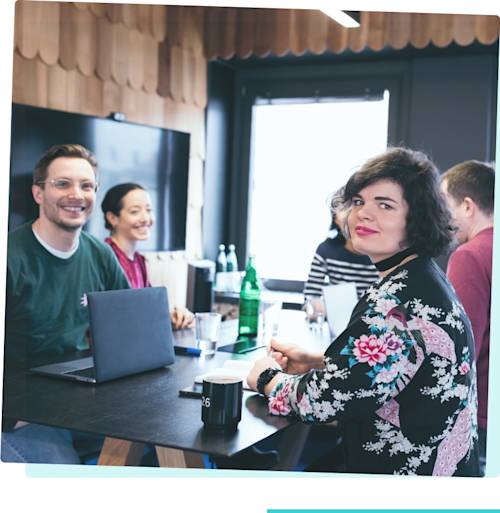 N26 employees sitting around a table in a meeting room.