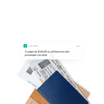 N26 - Notificación instantánea sobre un pago a una aerolínea con dos billetes de avión en el fondo.