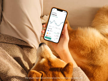 Dog looking at crypto performance on the n26 app.