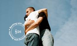 Two people hugging in a sunny day.