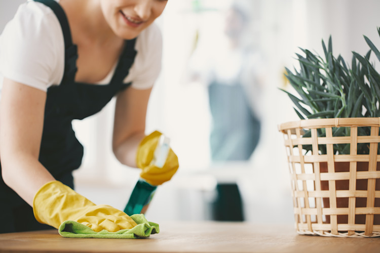 Woman cleaning table