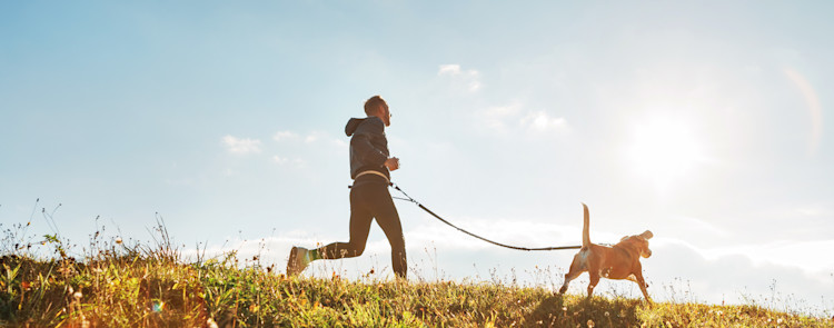 Man running with dog