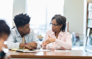 man and woman discussing on the table