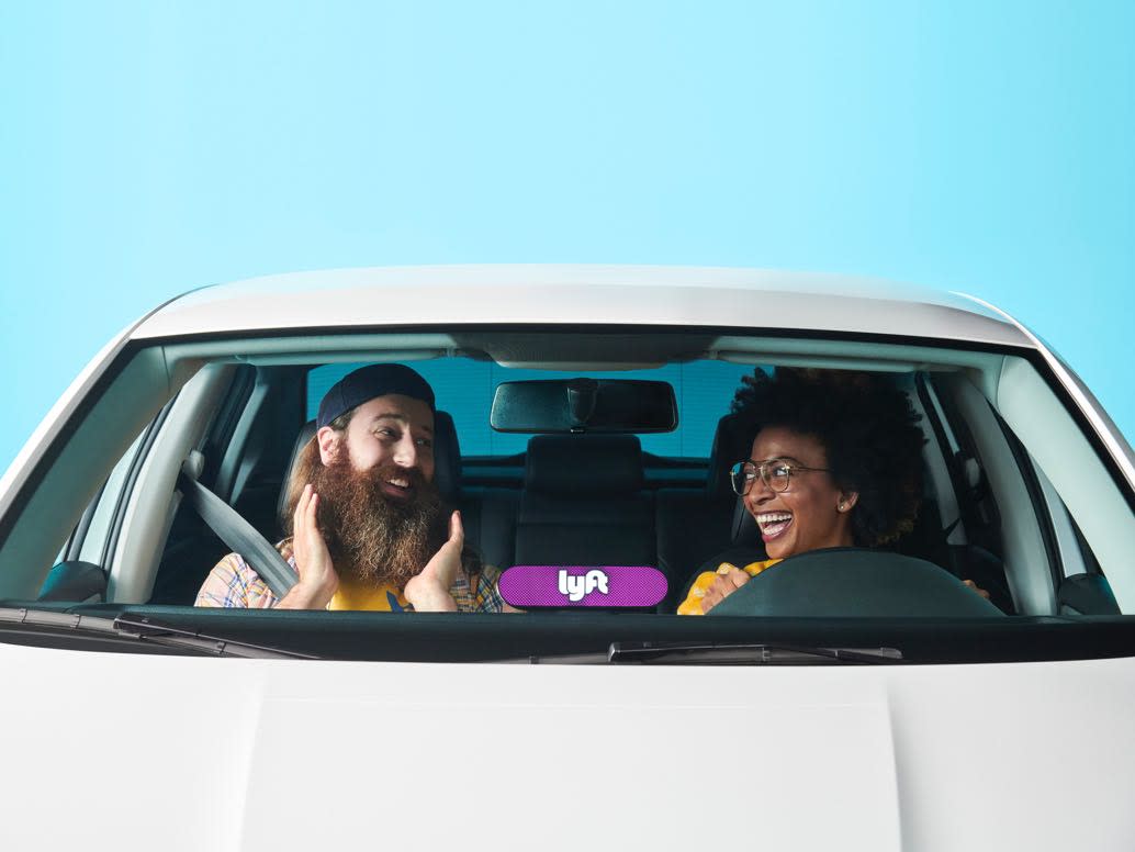 Lyft Driver and Passenger chatting together in the car