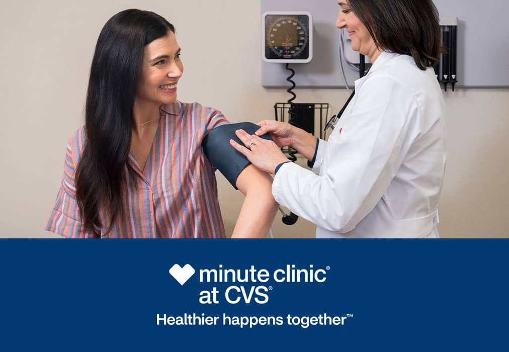 MinuteClinic® at CVS®, Healthier happens together™; practitioner taking a woman's blood pressure