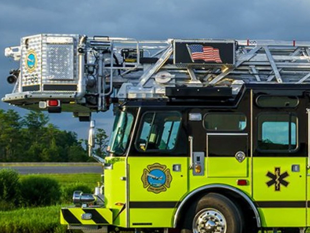 Ladder sprayer fire truck.