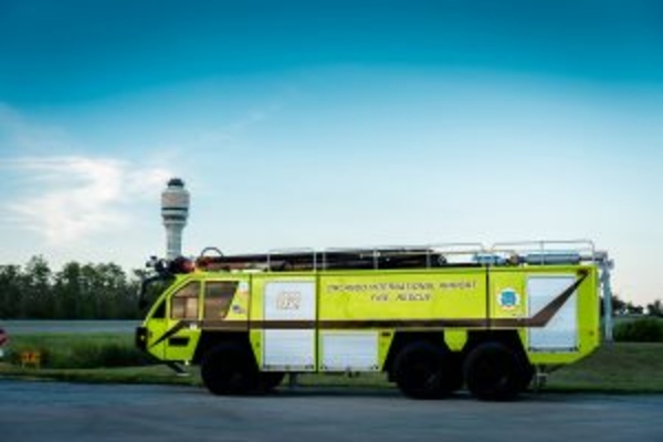ARFF fire vehicle with GOAA tower in the background.
