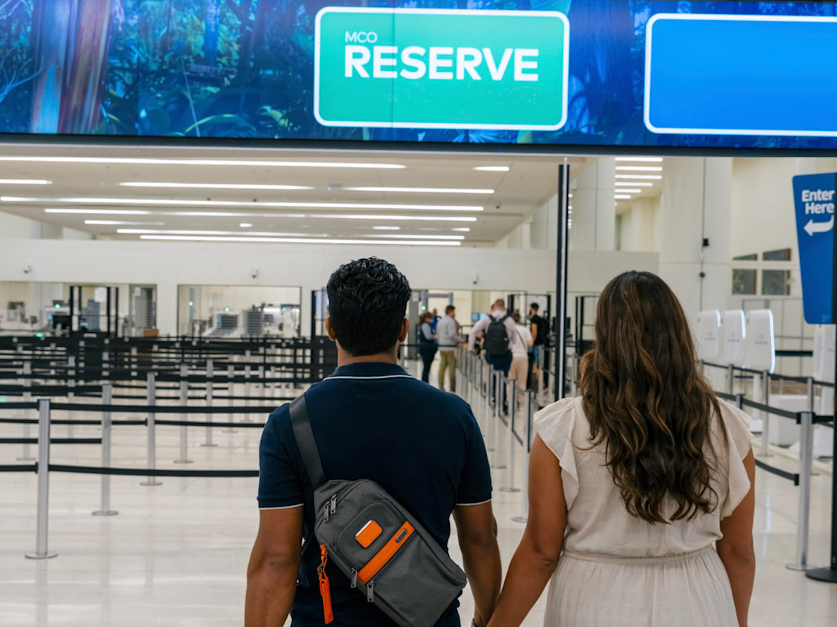 A couple walking towards MCO Reserve.