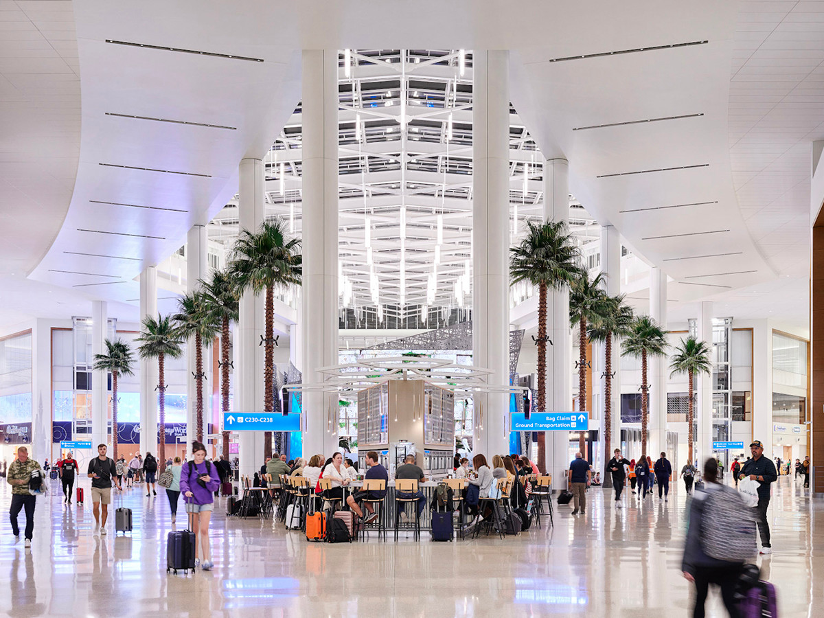 People walking around in Palm Court located in Terminal C at MCO.