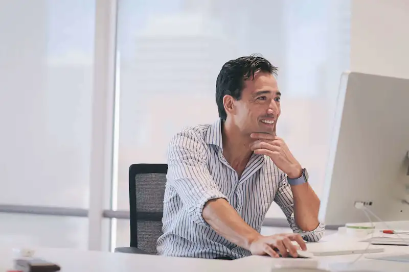man sat working at a computer