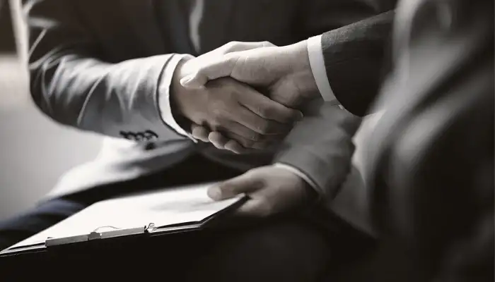 two businessmen shaking hands
