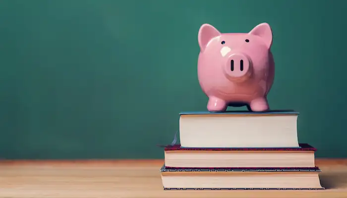 piggy bank on a stack of books