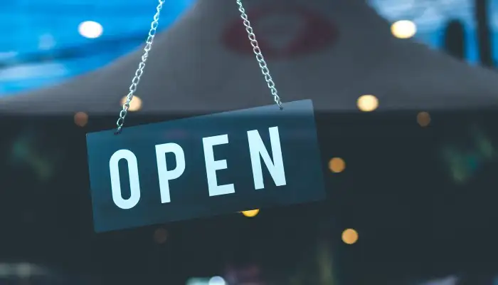 door displaying open sign in the window