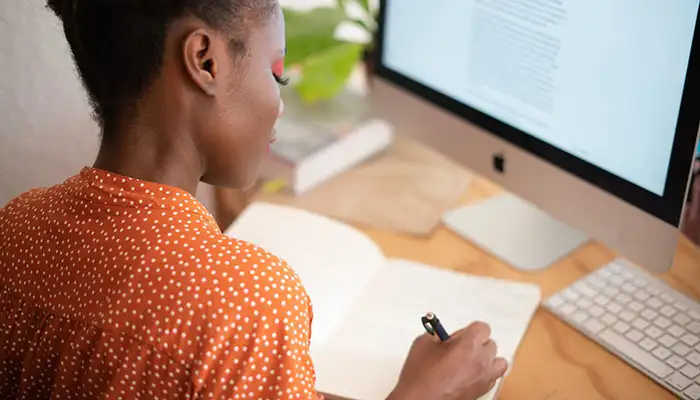 Image of a woman working on a business grant application