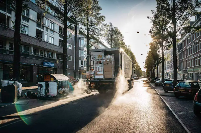 a lorry unloading in a suburban street