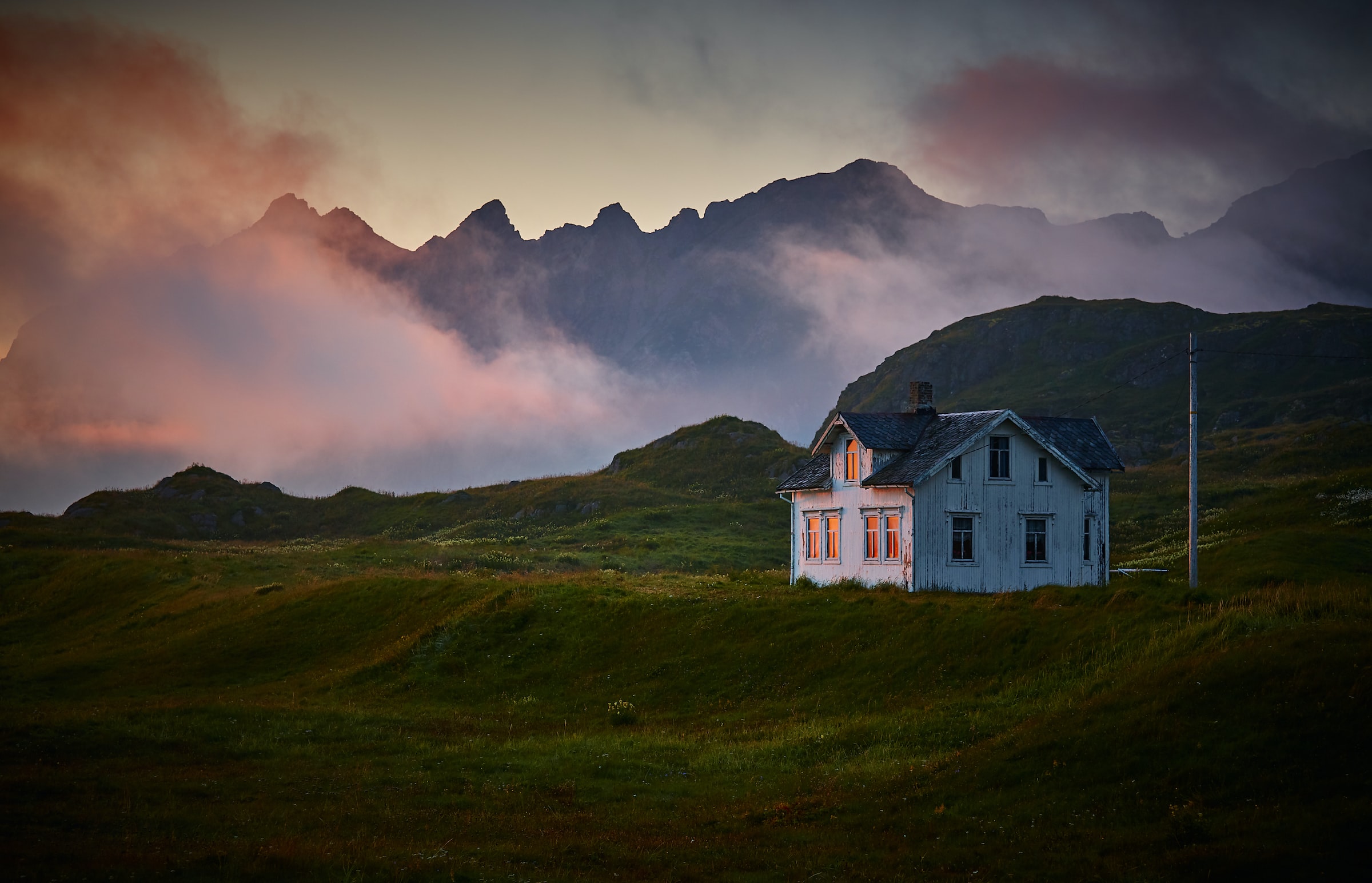 White and grey house on mountain under cloud
